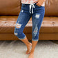 Distressed denim capribroek – edgy casual, verstelbare taille, cropped pasvorm
